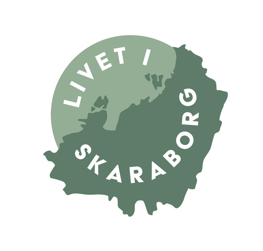 Logotyp för "Livet i Skaraborg". En grön, rund illustration som visar Skaraborg och Vänern. 