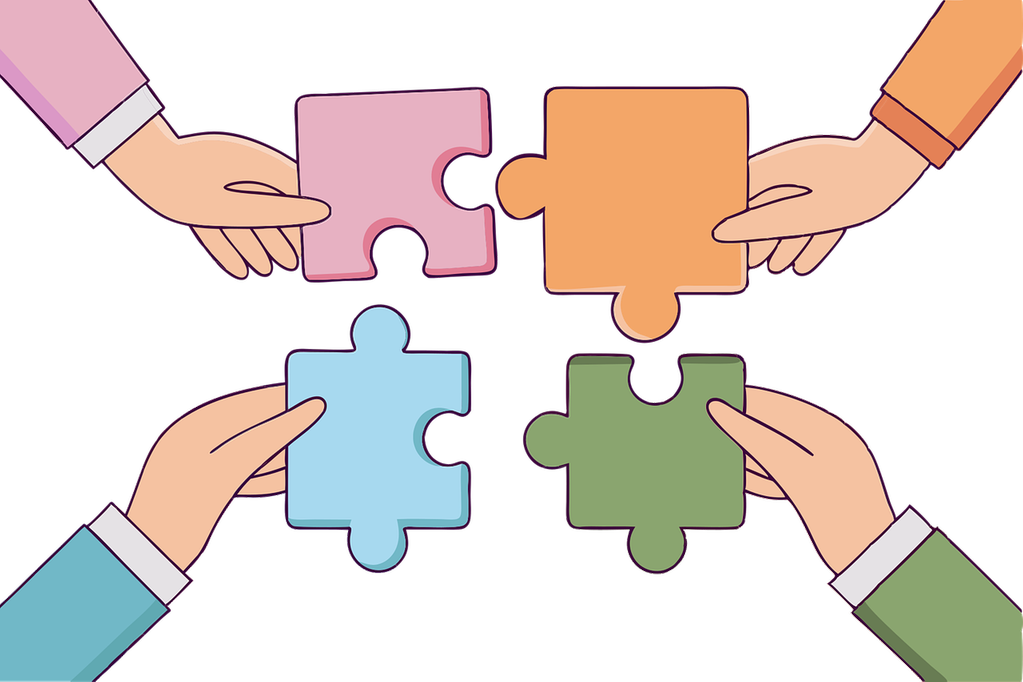 Fyra stycken olika händer som håller i var sina pusselbitar som ska passa ihop.