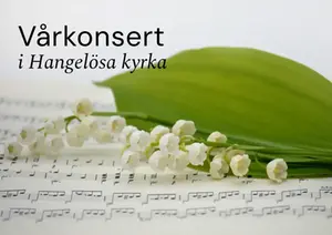 Liljekonvaljblomma som ligger på ett notblad.